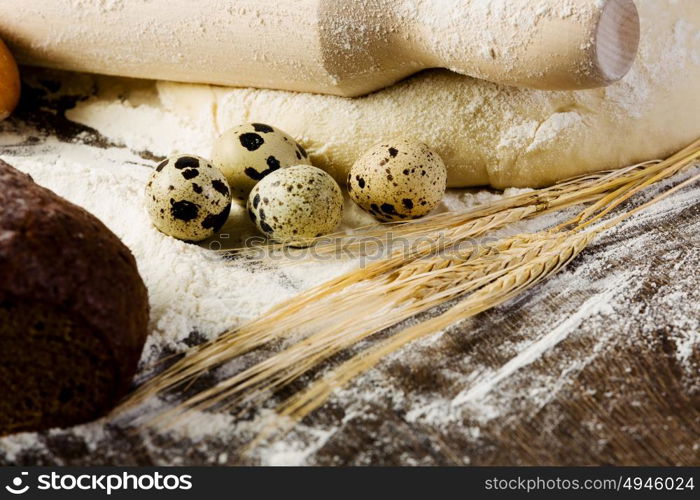 Baking. White bread drought and flour on kitchen table