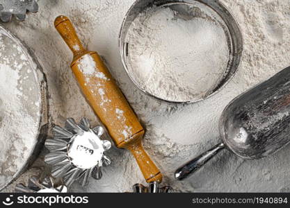 Baking. Wooden rolling pin and sieve. Top view. On a white background.. Baking. Wooden rolling pin and sieve. Top view.