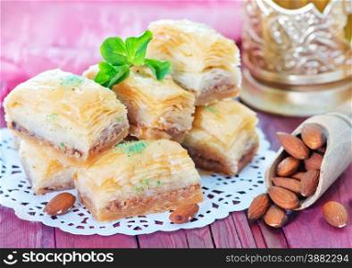 Baklava, Turkish dessert on metal plate and on a table