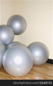 Balance balls stacked in gym.