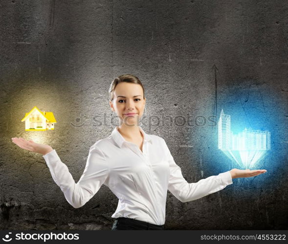 Balance concept. Image of businesswoman holding items on palm. Urban or country