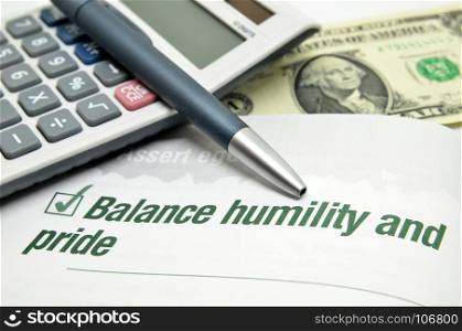 Balance humility and pride printed on book