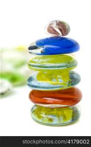 balanced colorful stones isolated on white background