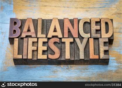 balanced lifestyle - word abstract in vintage letterpress wood type printing blocks against grunge wood