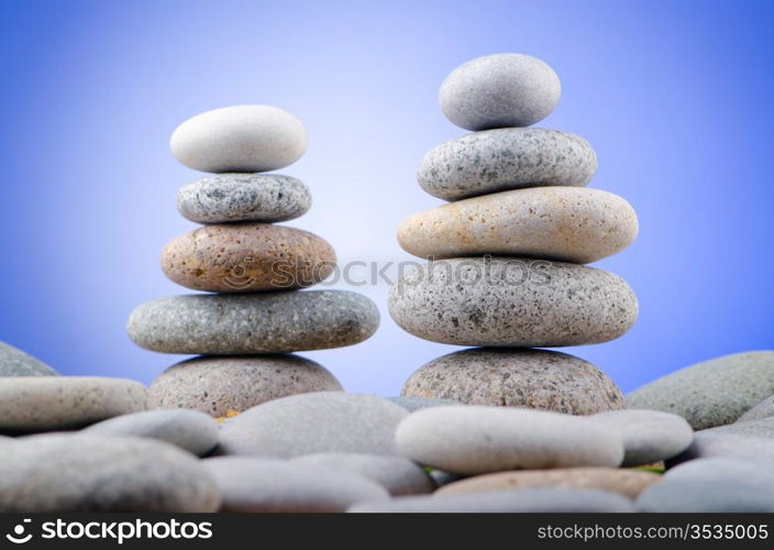 Balanced pebbles with colour background