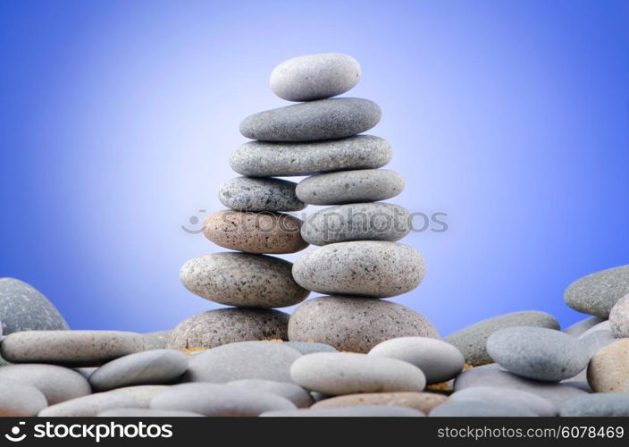 Balanced pebbles with colour background