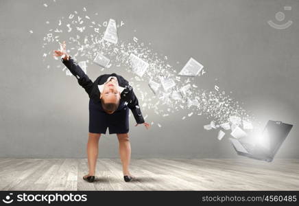 Balancing young woman evading from explosion of ideas. Businesswoman evades splash ideas