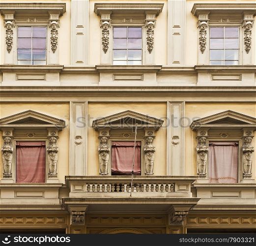 Balcony and windows on an elegant building in Bologna, Italy