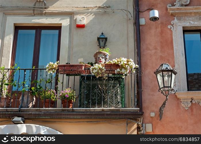 Balcony decorated with typical sicilian vases in Taormina, Italy