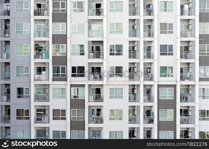 Balcony of condominium or apartment buildings windows. Glass architecture facade design in urban city, Downtown in city. Residential rooms.