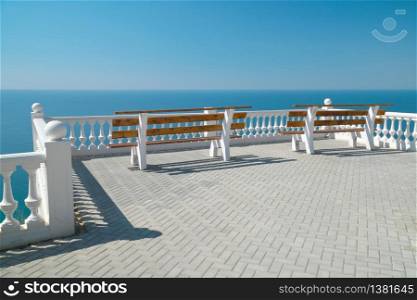 Balcony on the sea view with bench. Nature, relax, and resort, background scene.