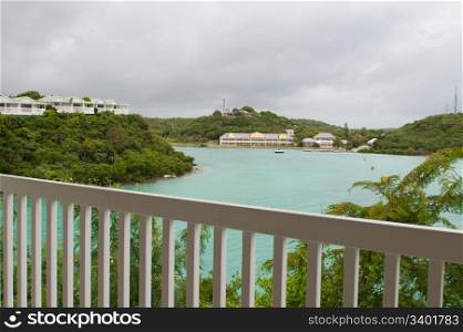 balcony view of Long Bay with resort villas and seascape in Antigua (overcast weather)