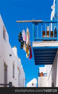 Balcony with airing clothes in Mykonos town, Greece