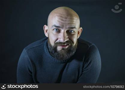 bald bearded mustache hipster. portrait. Blue eyes