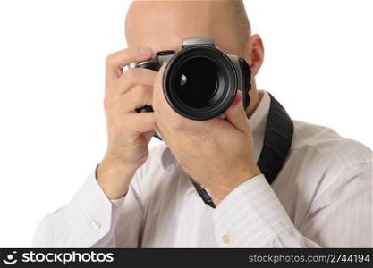 bald man holds a camera in his hands. Isolated on white background