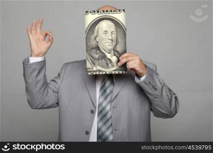 Bald young businessman with banknotes. Funny business image.