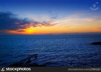 Balearic Formentera island sunset in Mediterranean seascape with warm lights