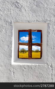 Balearic islands golden wheat field view through whitewashed house window