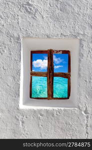 Balearic islands idyllic turquoise beach view through whitewashed house window