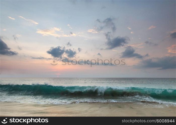 Bali beach sunset. Beautiful Bali sunset with reflection in beach sand