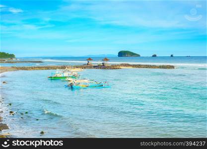 Bali island tropical seascape with traditional boats moored, Indonesia