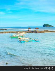 Bali island tropical seascape with traditional boats moored, Indonesia