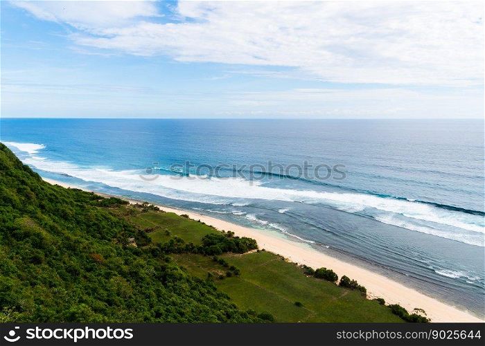 Bali seascape with huge waves at beautiful hidden white sand beach. Bali sea beach nature, outdoor Indonesia