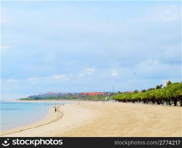 Bali sunny ocean beach with cloudy sky.. Bali island coastline