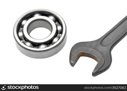Ball bearing and Wrench isolated on white