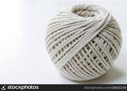 ball of string on a white background with room for copy