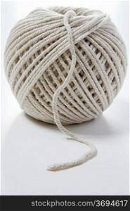 ball of string on a white background with room for copy
