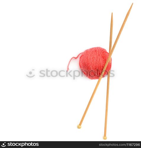 Ball of woolen thread and knitting needles isolated on white background. The concept is hobbies and handicrafts. Free space for text.