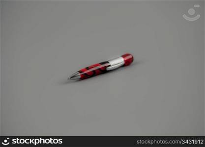 Ball pen on gray background