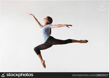 Ballerina Leaping in Mid-air