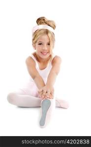 Ballerina little ballet children dancer stretching sitting on white floor