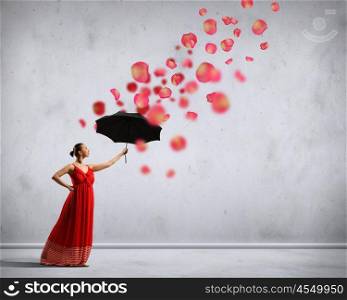 Ballet dancer in flying satin dress with umbrella. ballet dancer in flying satin dress with umbrella under the paint