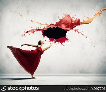 Ballet dancer in flying satin dress with umbrella. ballet dancer in flying satin dress with umbrella under the paint
