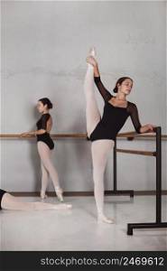 ballet dancers training together with pointe shoes