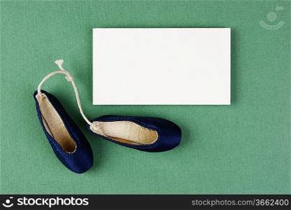 ballet slippers pointe gift and blank business card on the green background