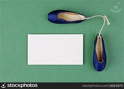 ballet slippers pointe gift and blank business card on the green background