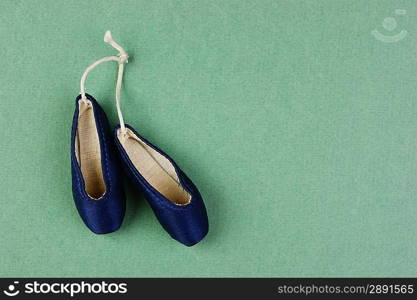 ballet slippers pointe gift on the green background