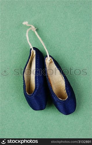 ballet slippers pointe on the green background