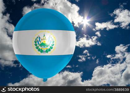 balloon in colors of el salvador flag flying on blue sky