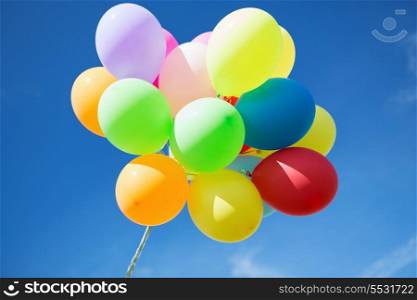 balloons and celebration concept - lots of colorful balloons in the sky