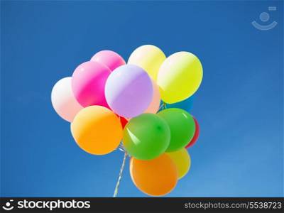 balloons and celebration concept - lots of colorful balloons in the sky