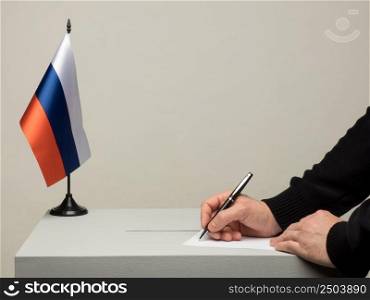Ballot box with national flag of Russia. Presidential election in 2018. hand throwing a ballot. the Russian tricolor flag