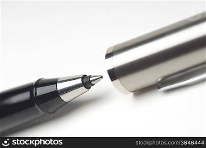 Ballpoint pen on white background, close-up