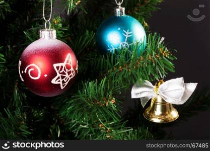 balls and bell on the artificial Christmas tree