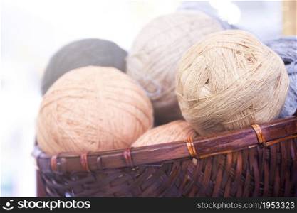 Balls Of Yarn In Basket, On Wooden Background And Copy Space.