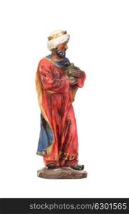Baltasar, one of the three wise men. Ceramic figure isolated on white background